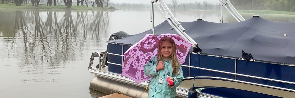 Bea standing on the dock in the rain